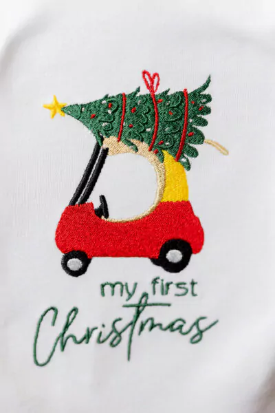 Babybody "my first Christmas" mit Einkaufsauto und Weihnachtsbaum