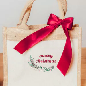 Jute Geschenktasche Merry Christmas klein mit Weihnachtszweig und Masche
